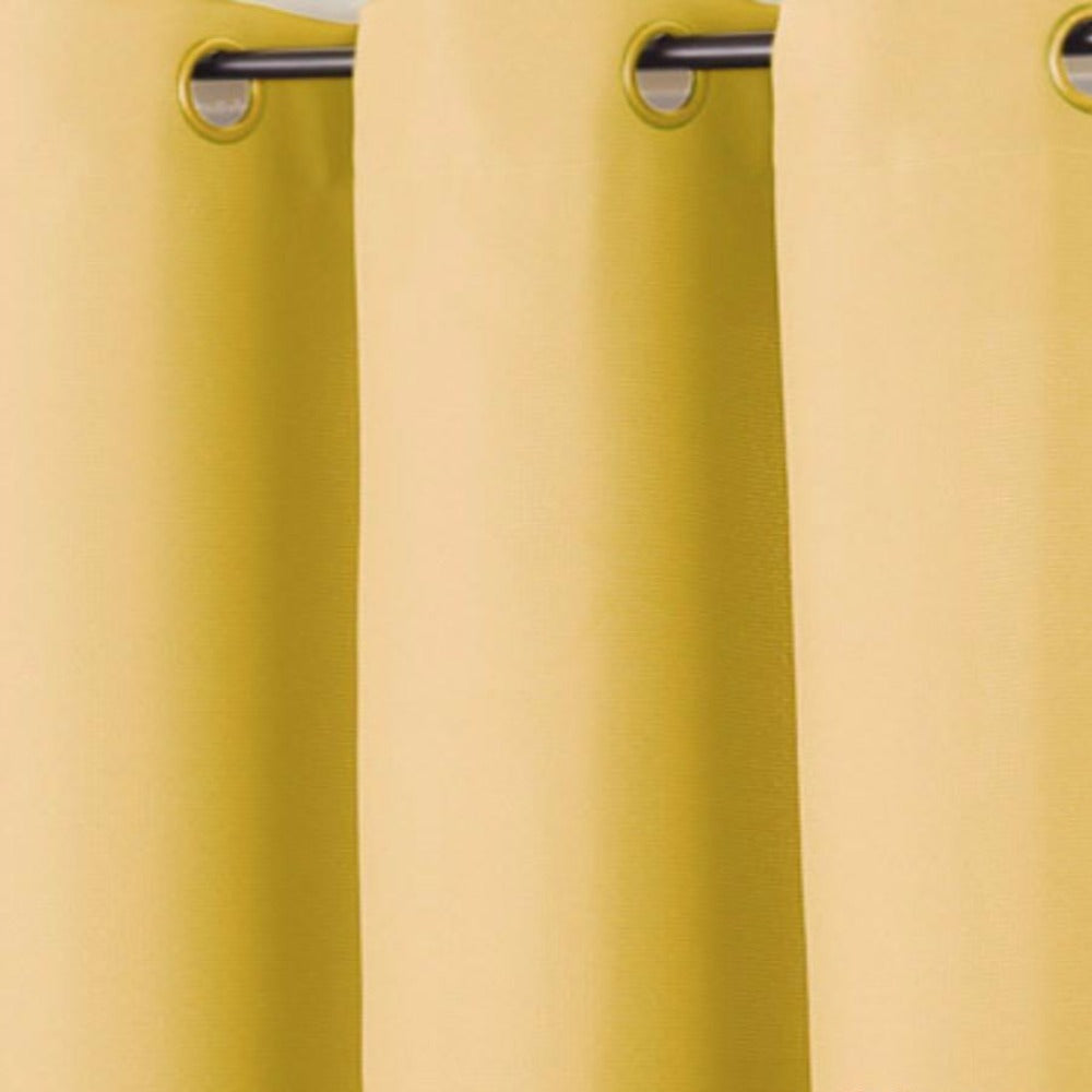 up close shot of Yellow No. 918 Montego Grommet Top Textured Panel fabric and grommets