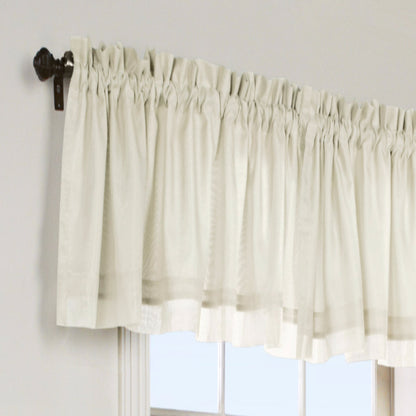 Ivory Rhapsody Lined Thermavoile Tailored Kitchen Valance hanging on a decorative rod