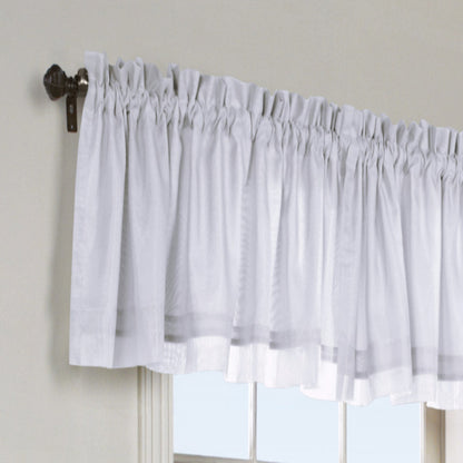White Rhapsody Lined Thermavoile Tailored Kitchen Valance hanging on a decorative rod