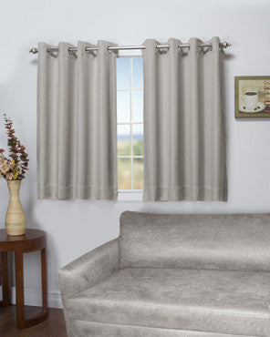 Stone Tacoma Double Blackout Shortie Grommet Top Panels hanging on a decorative curtain rod