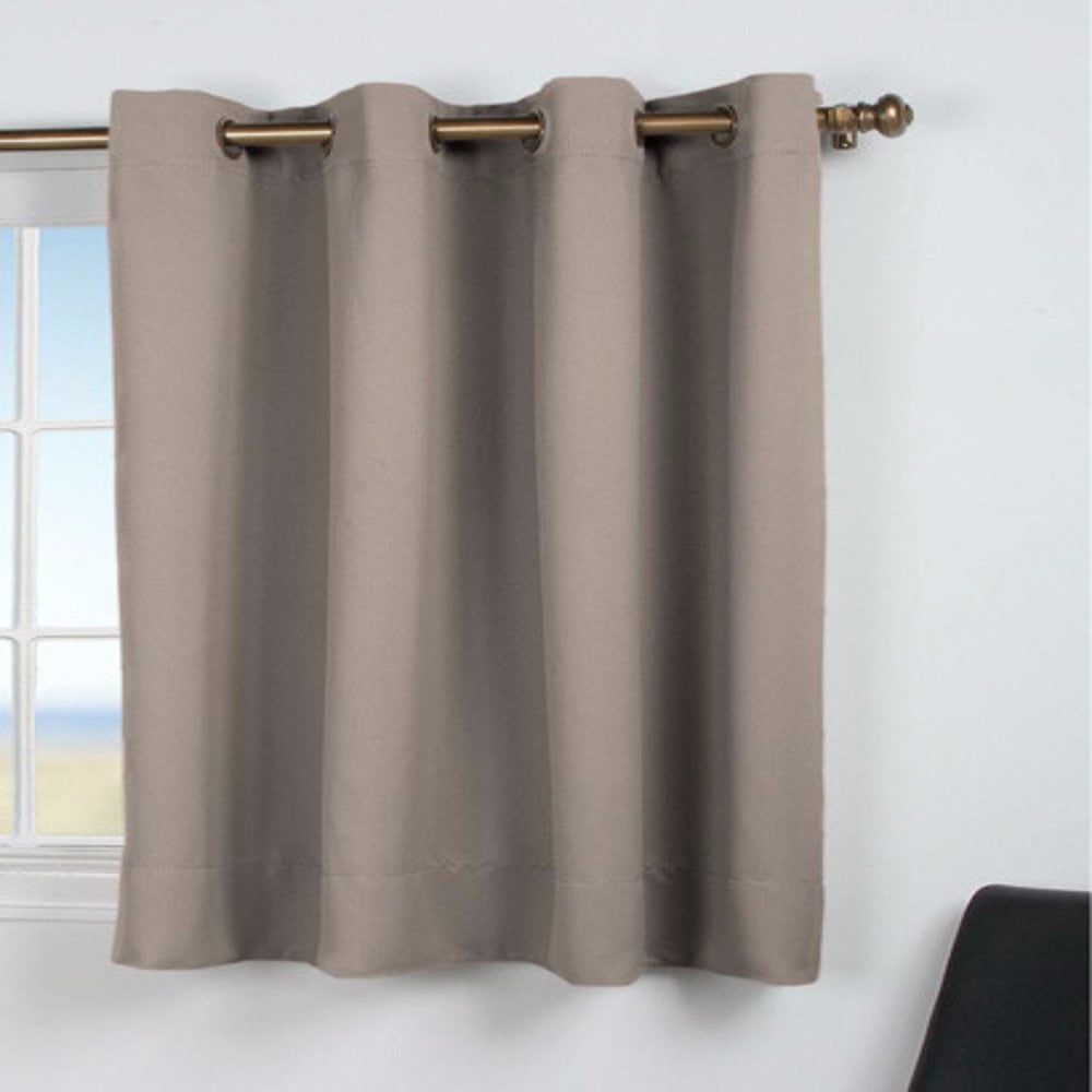 Grey Ultimate Blackout Grommet Top Shortie Panel hanging on a decorative curtain rod 