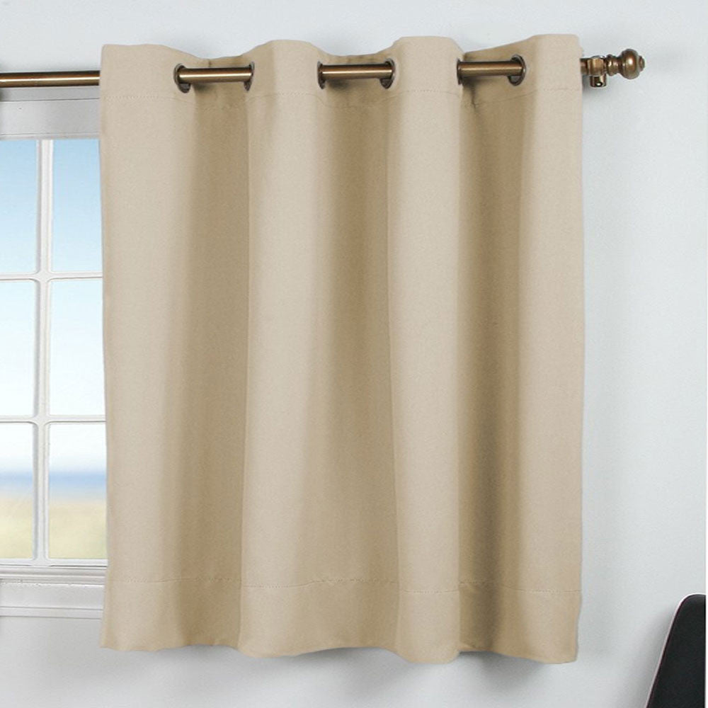 Ivory Ultimate Blackout Grommet Top Shortie Panel hanging on a decorative curtain rod 