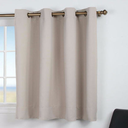 Putty Ultimate Blackout Grommet Top Shortie Panel hanging on a decorative curtain rod 